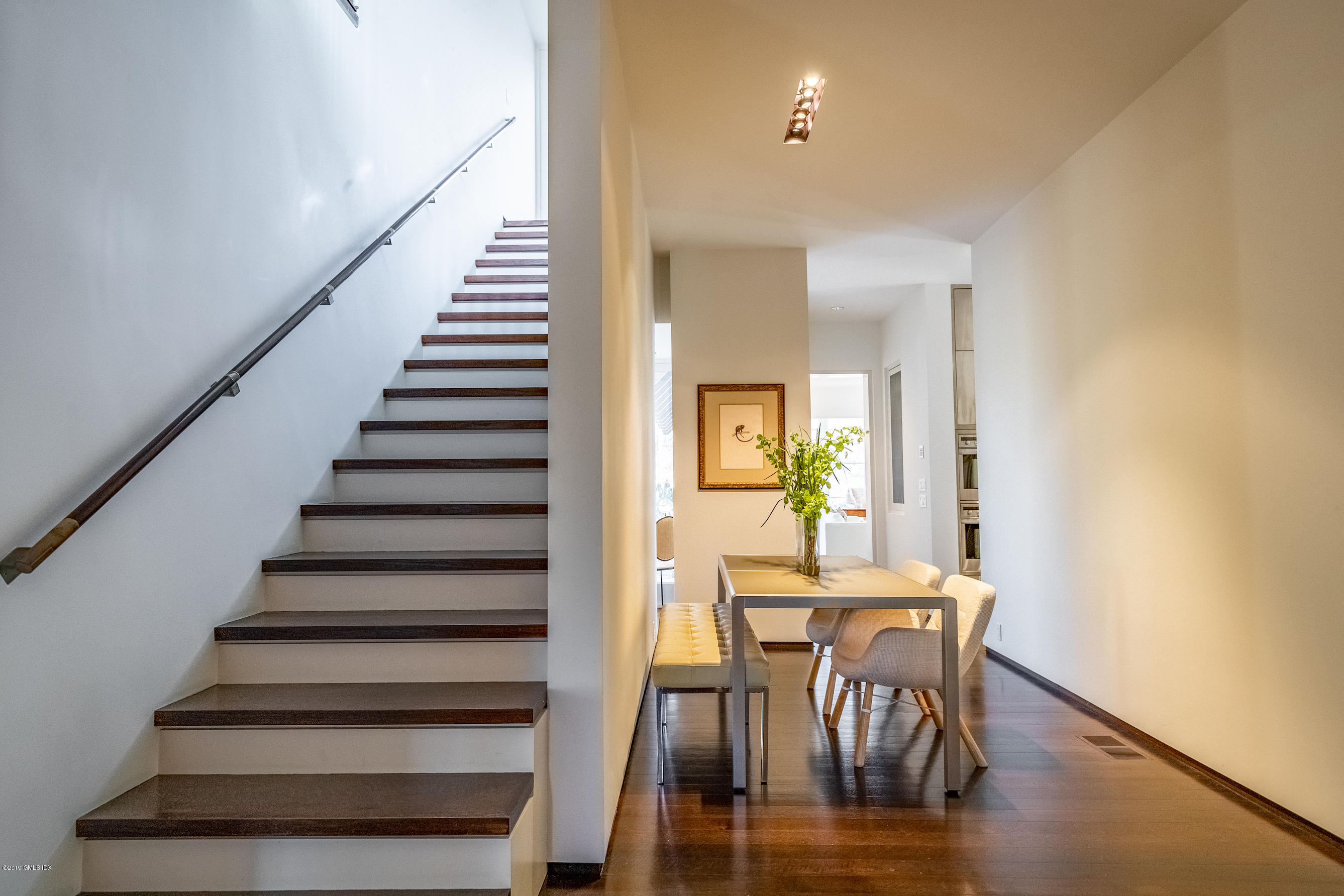 373 Riverbank Road Stamford, CT 06903 - Photo 14 of 35 a view of a dining room with furniture and wooden floor