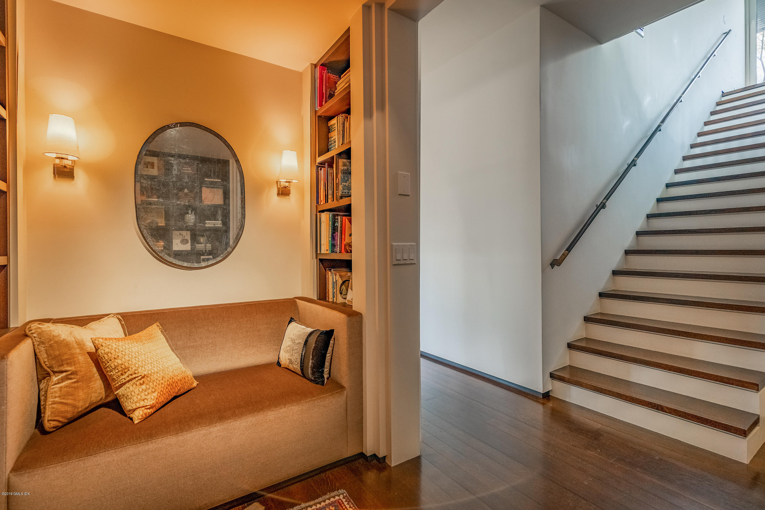 373 Riverbank Road Stamford, CT 06903 - Photo 15 of 35 a view of a livingroom with furniture and staircase