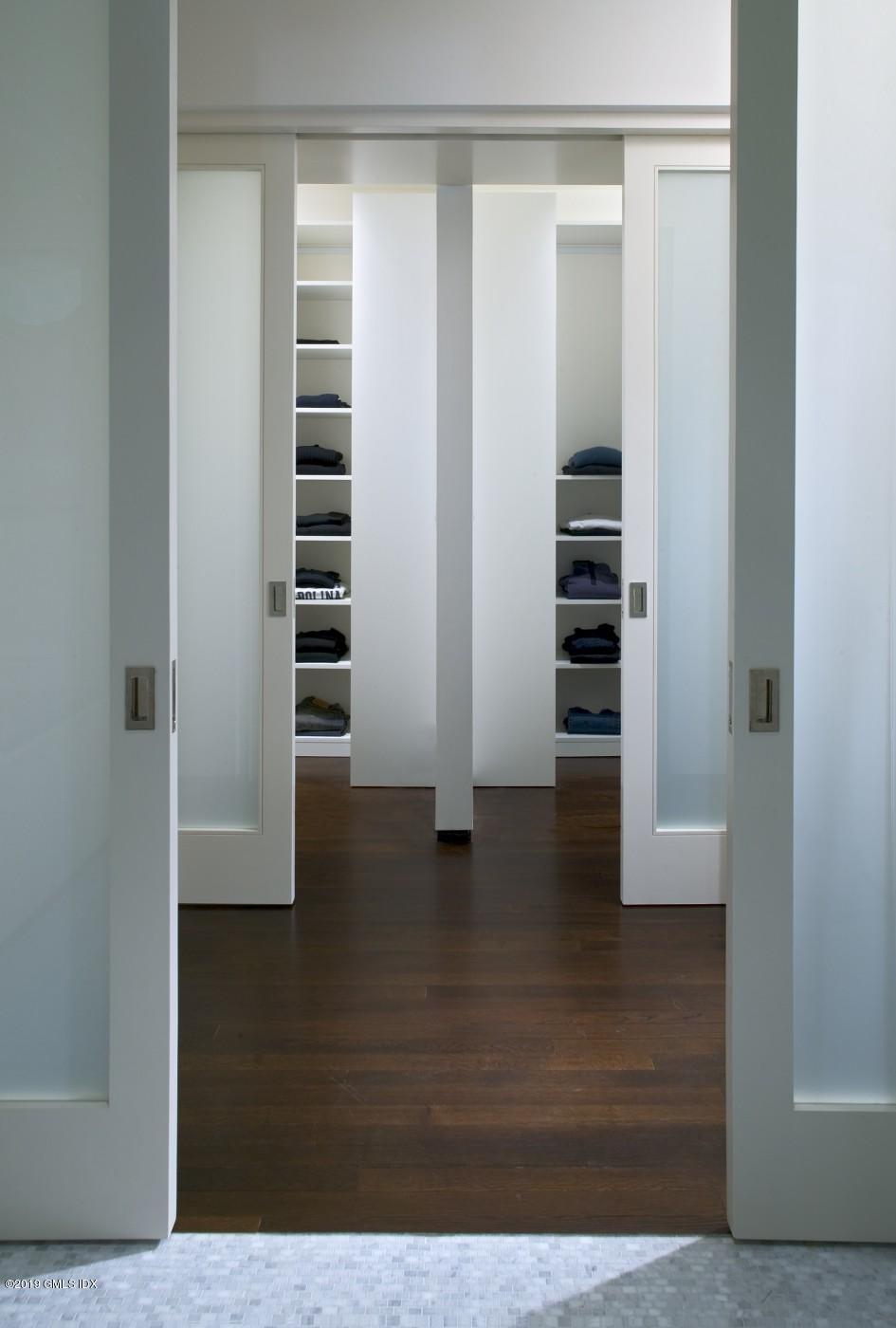 373 Riverbank Road Stamford, CT 06903 - Photo 24 of 35 a view of walk in closet with empty racks