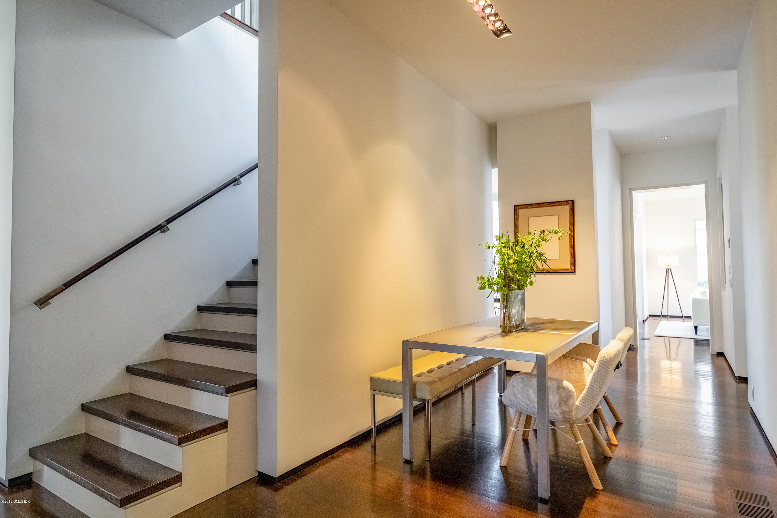 373 Riverbank Road Stamford, CT 06903 - Photo 28 of 35 a view of a dining room with furniture and wooden floor