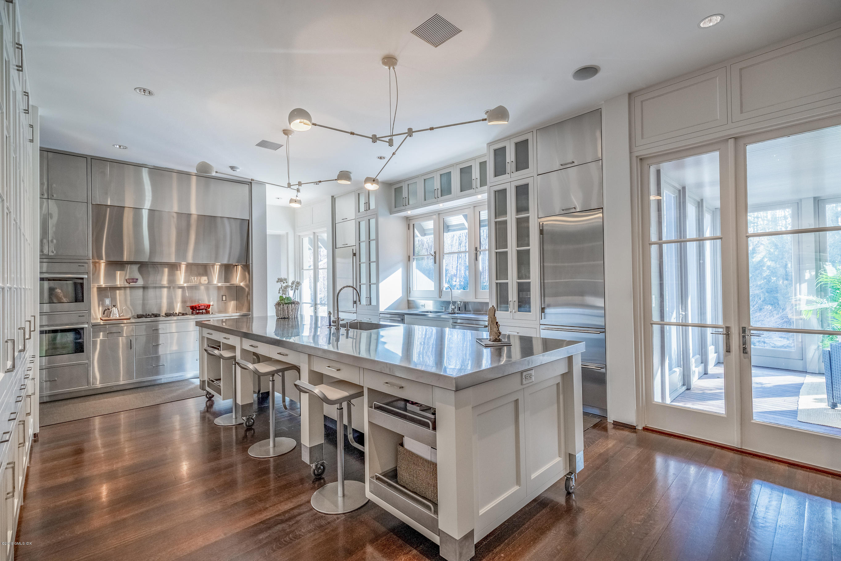 373 Riverbank Road Stamford, CT 06903 - Photo 31 of 35 a kitchen with stainless steel appliances granite countertop a stove and cabinets