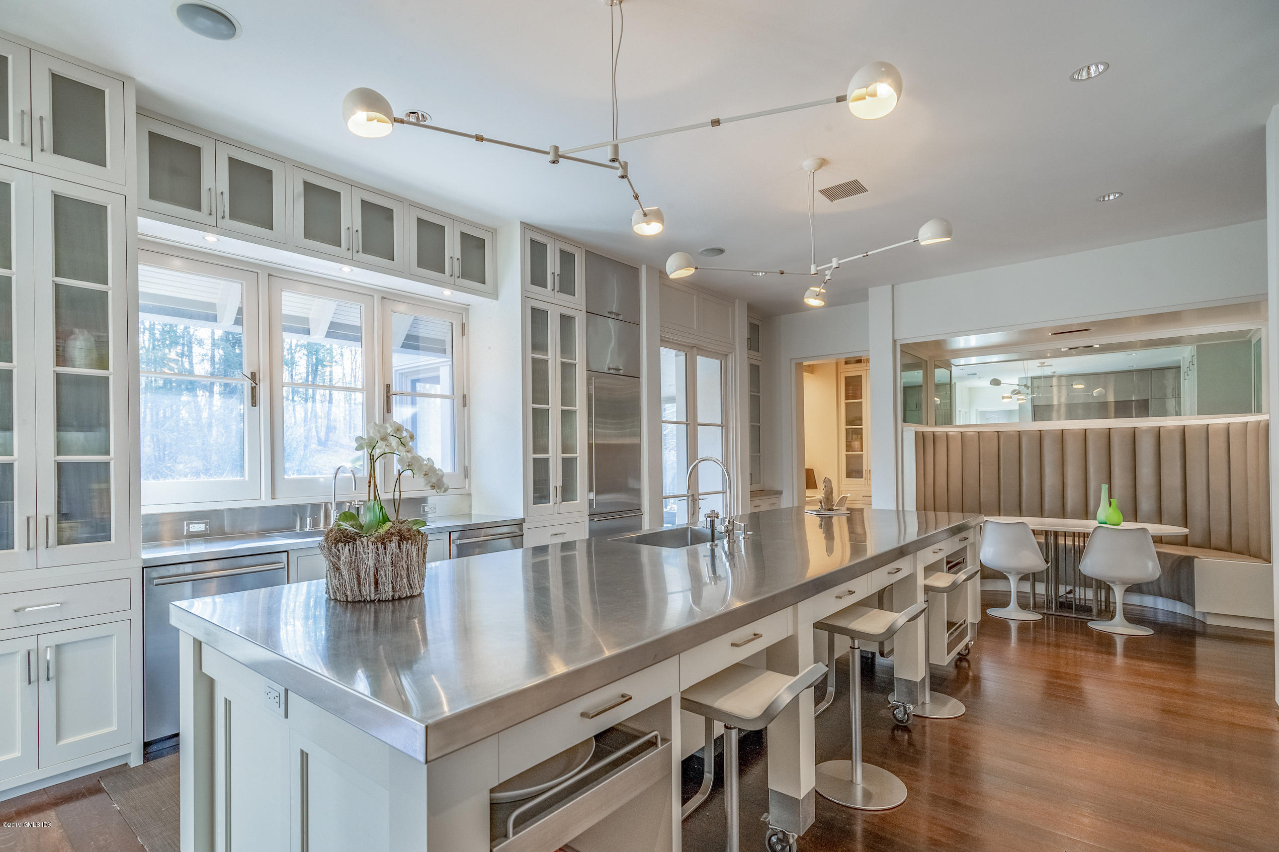 373 Riverbank Road Stamford, CT 06903 - Photo 7 of 35 a kitchen with lots of counter space and windows