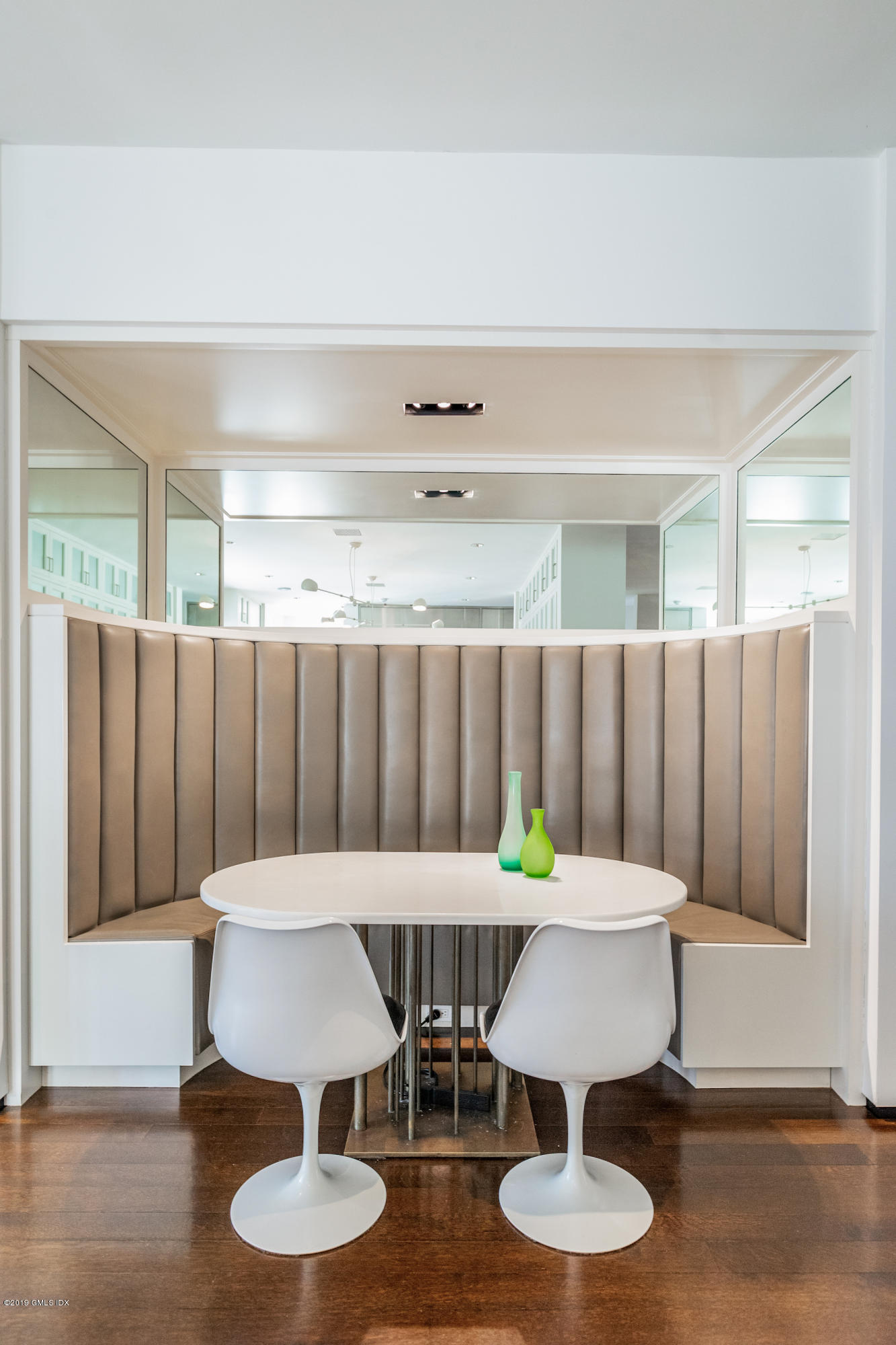 373 Riverbank Road Stamford, CT 06903 - Photo 9 of 35 a kitchen with a table chairs and a table