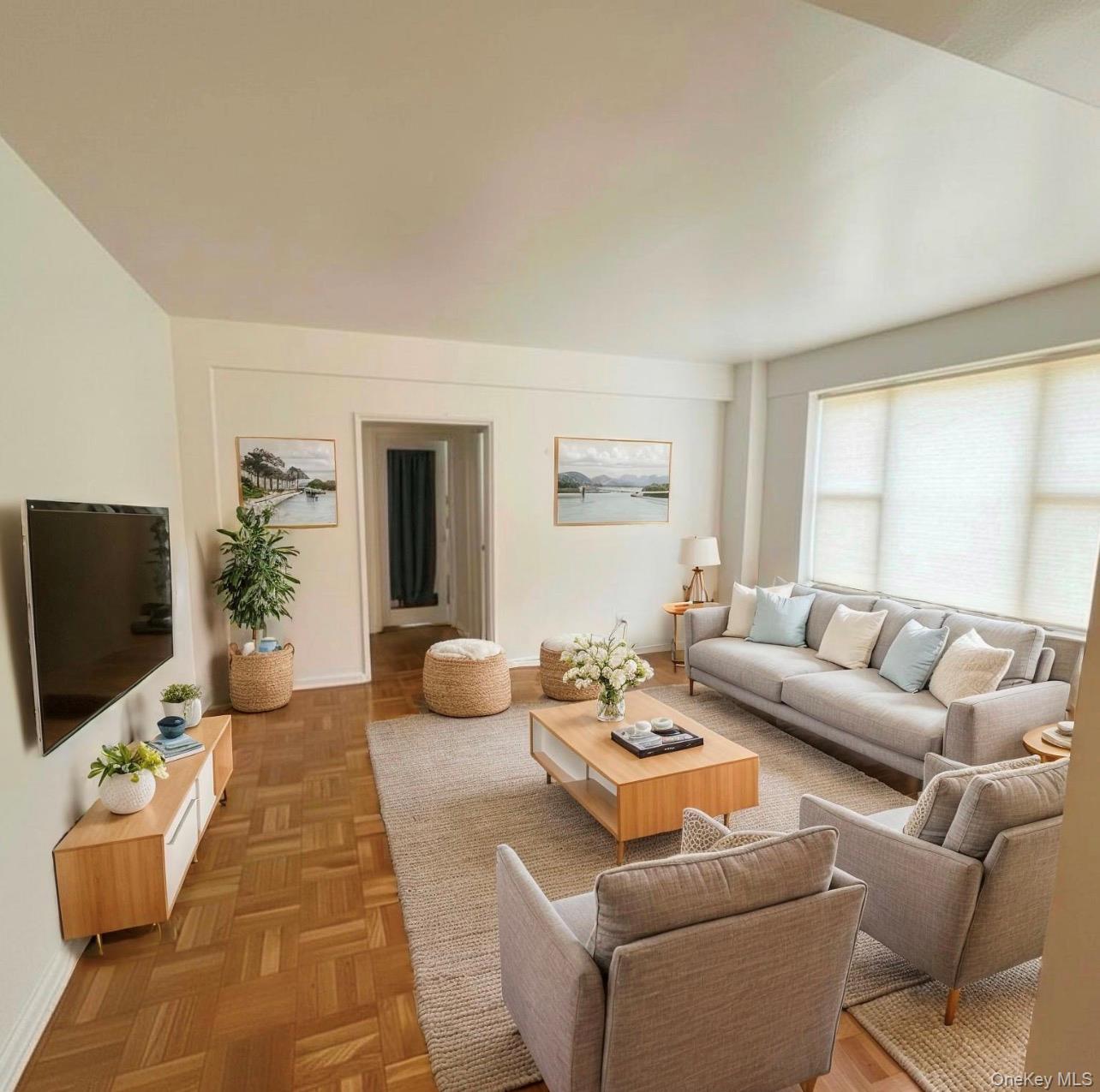 a living room with furniture and a flat screen tv