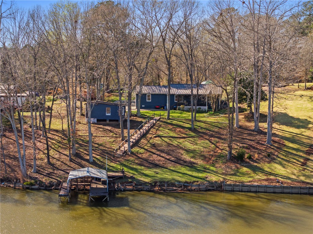 122 Latham Drive Anderson, SC 29621 - Photo 2 of 40 This lakeside home offers serene waterfront living with a private dock and ample outdoor space.