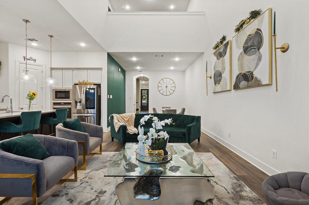 1124 Queensdown Way Forney, TX 75126 - Photo 16 of 34 a living room with furniture and kitchen view