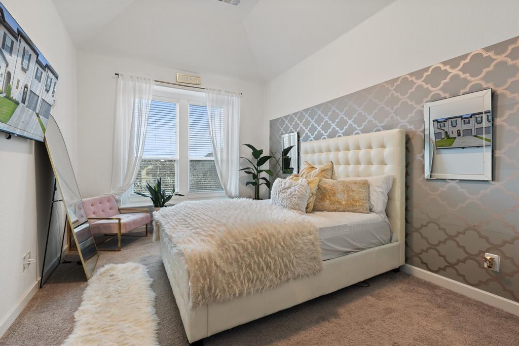 1124 Queensdown Way Forney, TX 75126 - Photo 17 of 34 a bedroom with a bed and wooden floor