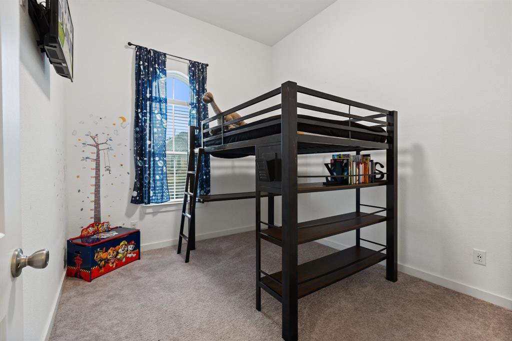 1124 Queensdown Way Forney, TX 75126 - Photo 23 of 34 a bedroom with bunk bed