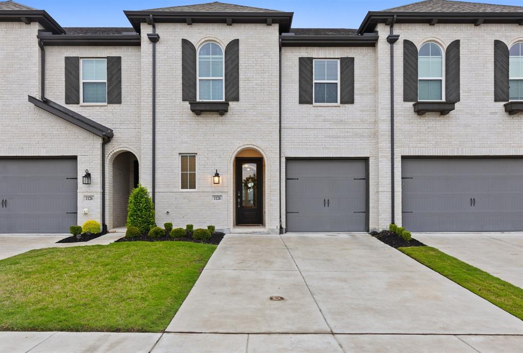 1124 Queensdown Way Forney, TX 75126 - Photo 28 of 34 a front view of a house with garden