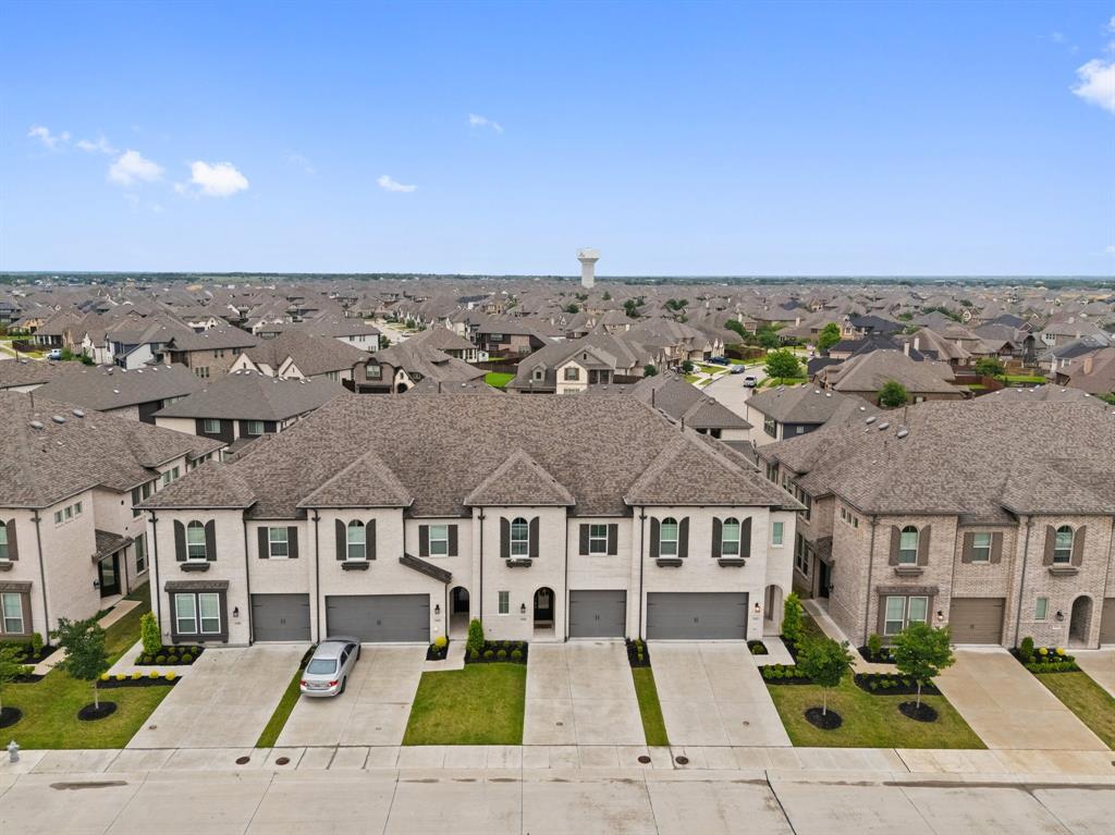 1124 Queensdown Way Forney, TX 75126 - Photo 29 of 34 an aerial view of multiple houses with a big yard