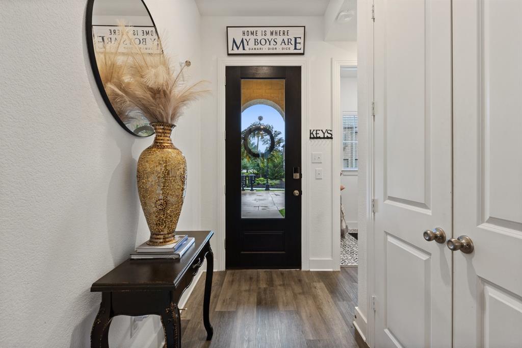 1124 Queensdown Way Forney, TX 75126 - Photo 3 of 34 a view of a entryway door with wooden floor