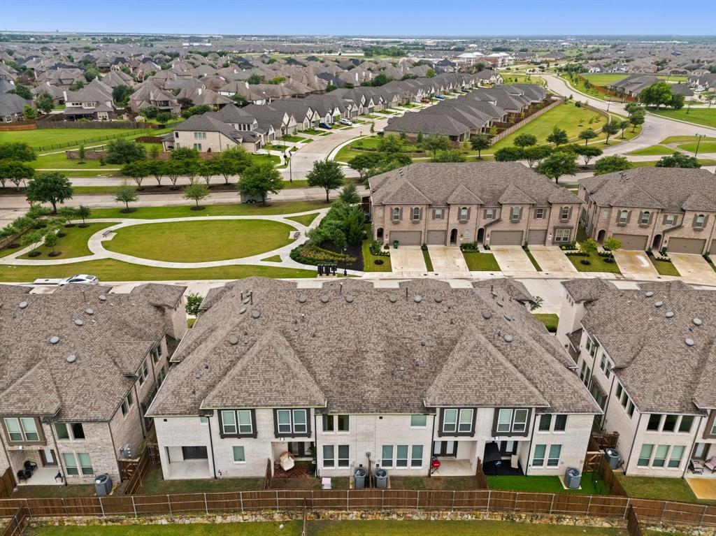 1124 Queensdown Way Forney, TX 75126 - Photo 31 of 34 an aerial view of residential houses with outdoor space and ocean view