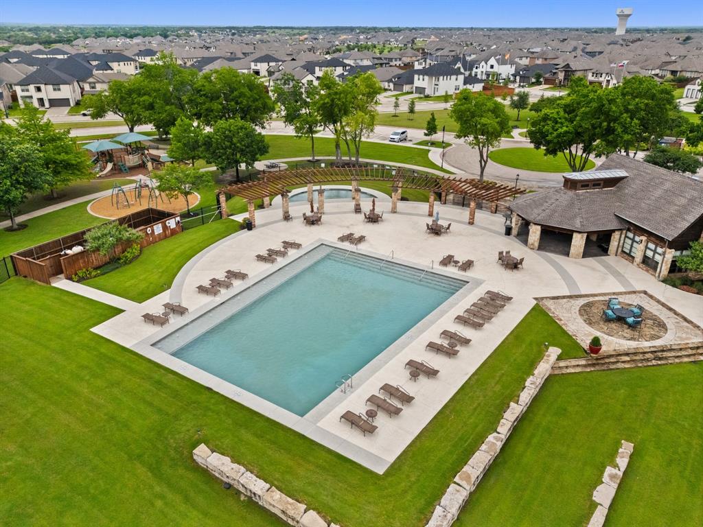 1124 Queensdown Way Forney, TX 75126 - Photo 33 of 34 an aerial view of a pool yard and mountain view in back