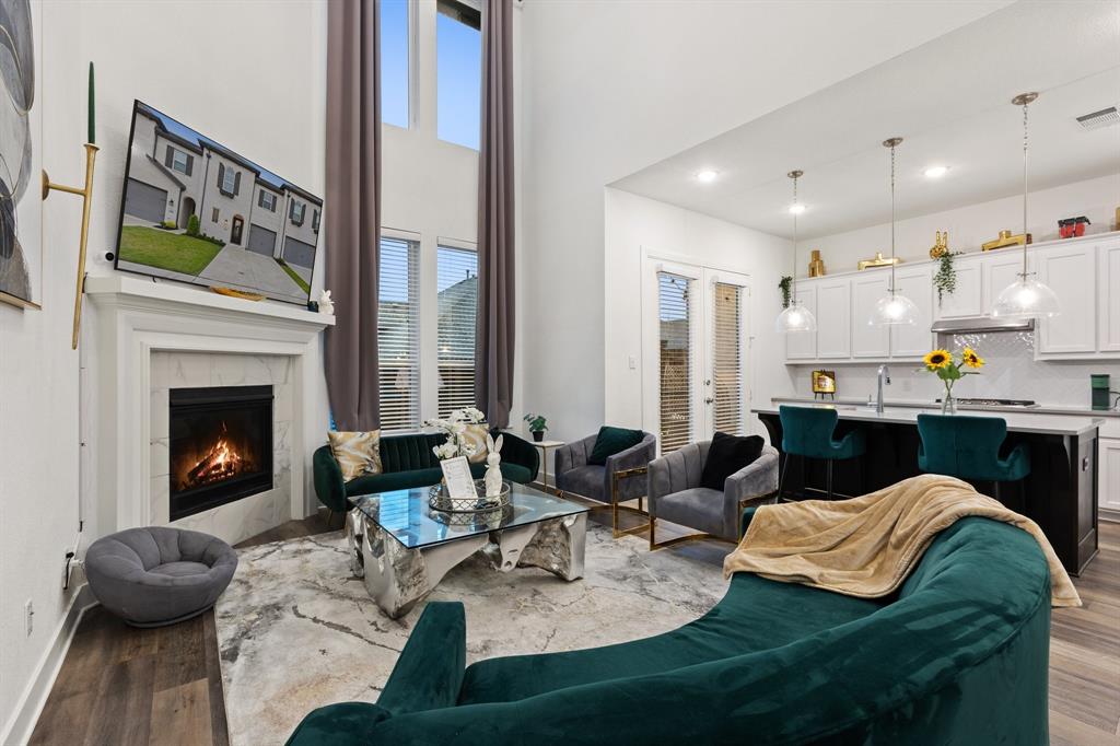 1124 Queensdown Way Forney, TX 75126 - Photo 5 of 34 a living room with furniture and a fireplace