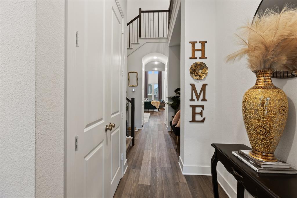 1124 Queensdown Way Forney, TX 75126 - Photo 7 of 34 a view of a livingroom with wooden floor
