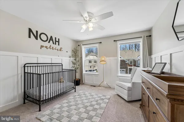 a bedroom with furniture and window