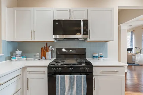 a kitchen with stainless steel appliances a refrigerator and a sink