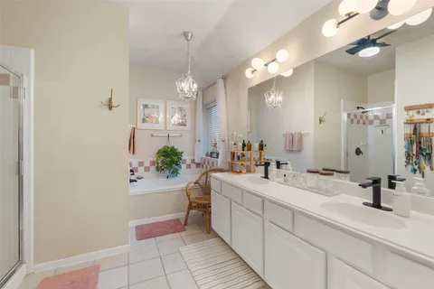 a bathroom with a shower and a sink