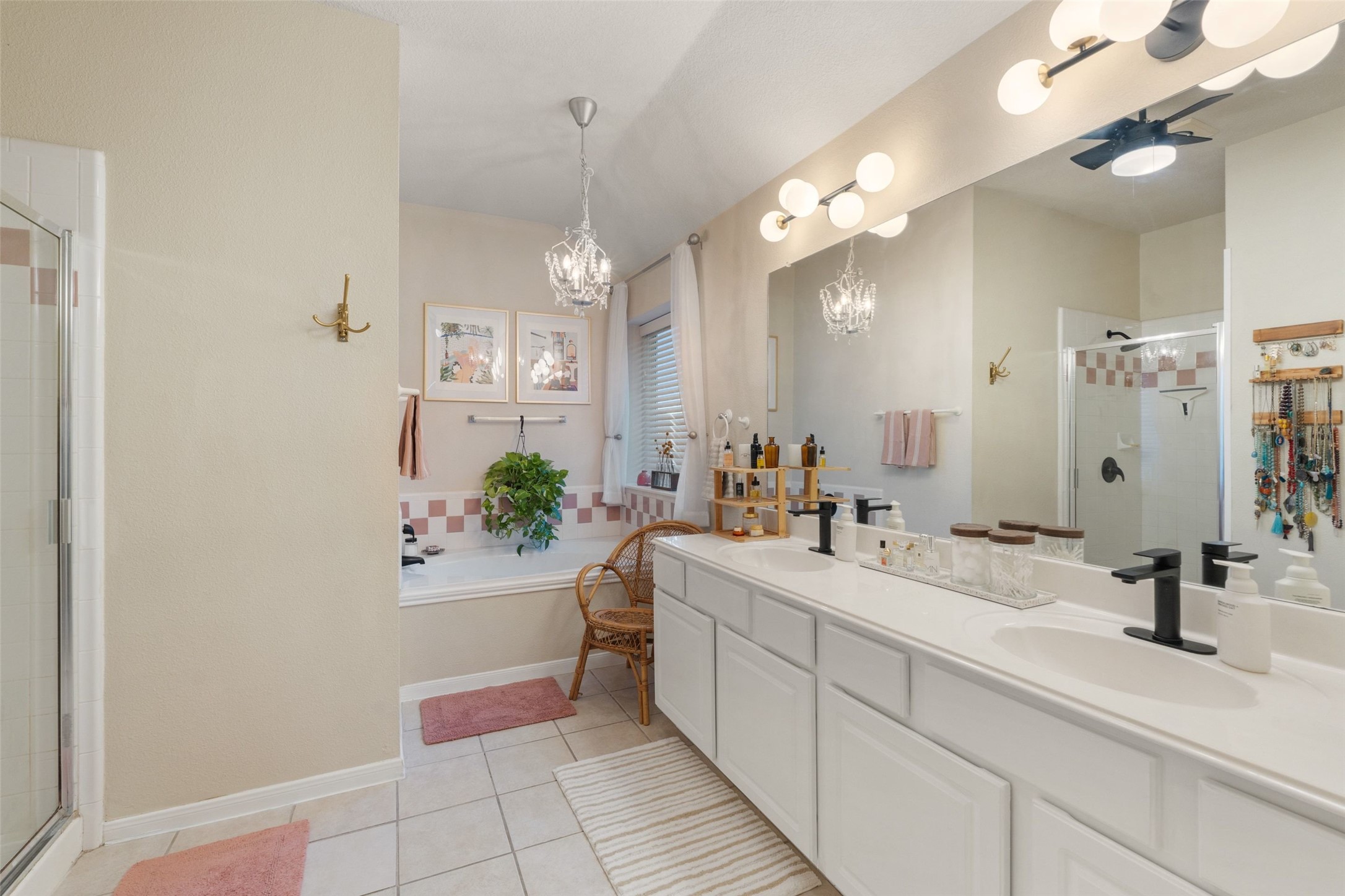11016 Amaranth Lane Austin, TX 78754 - Photo 28 of 36 a bathroom with a sink a large mirror and a shower