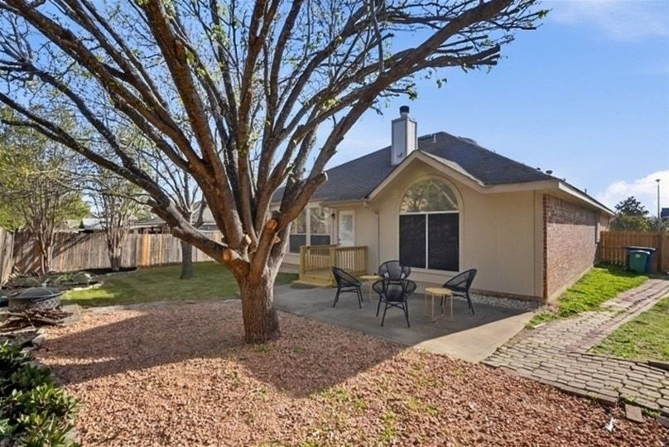 11016 Amaranth Lane Austin, TX 78754 - Photo 33 of 36 a view of a house with a yard