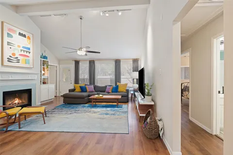 a view of a living room and a wooden floor