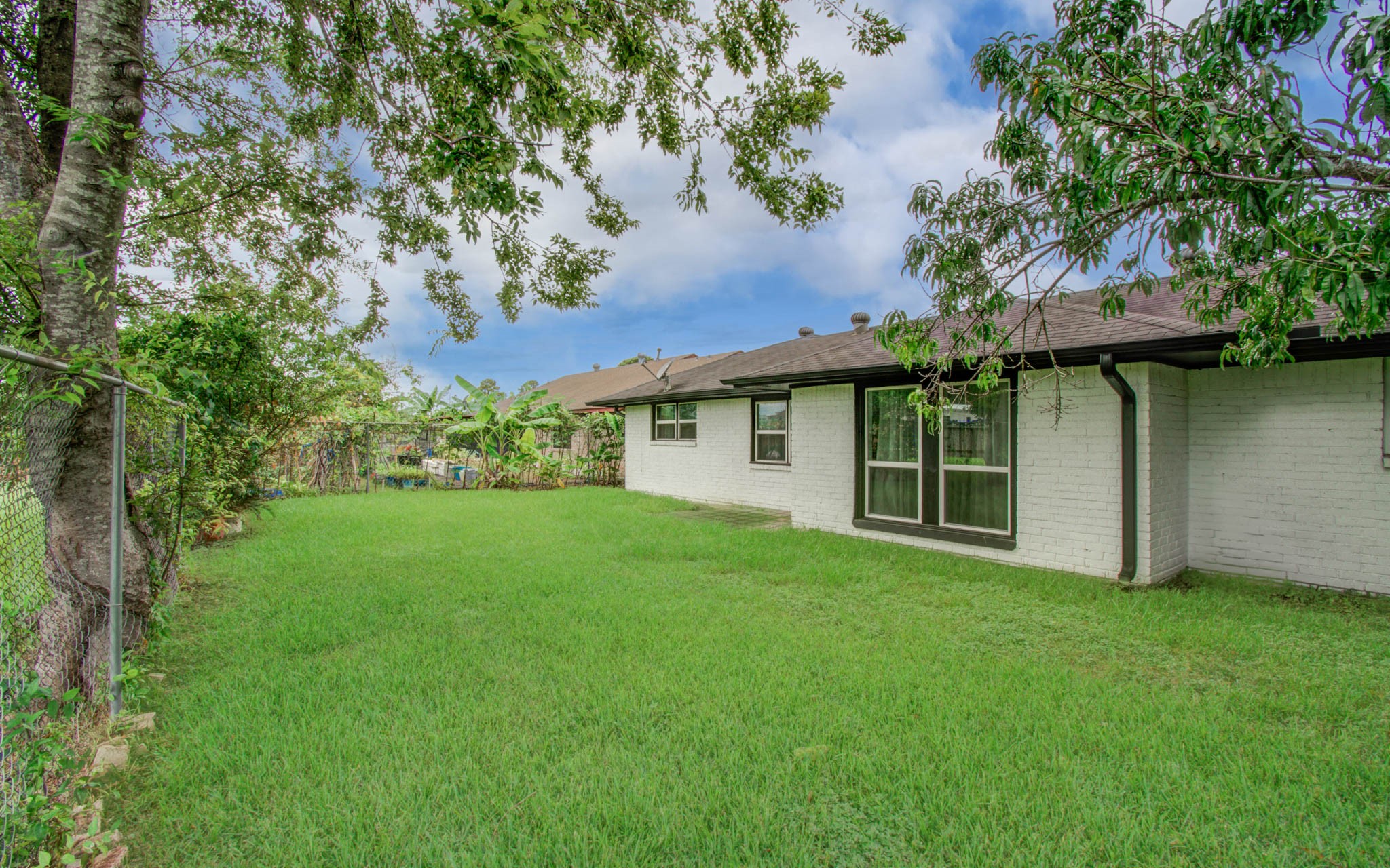 1327 Fallbrook Drive Houston, TX 77038 - Photo 34 of 34 a view of a house with a yard