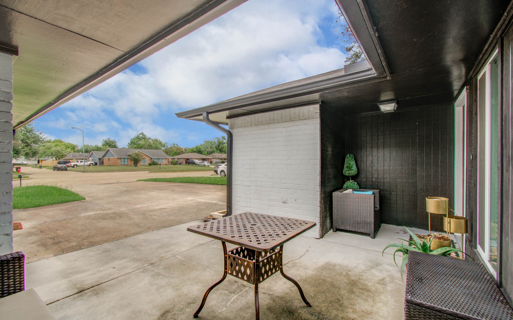1327 Fallbrook Drive Houston, TX 77038 - Photo 6 of 34 a view of a porch with furniture and yard