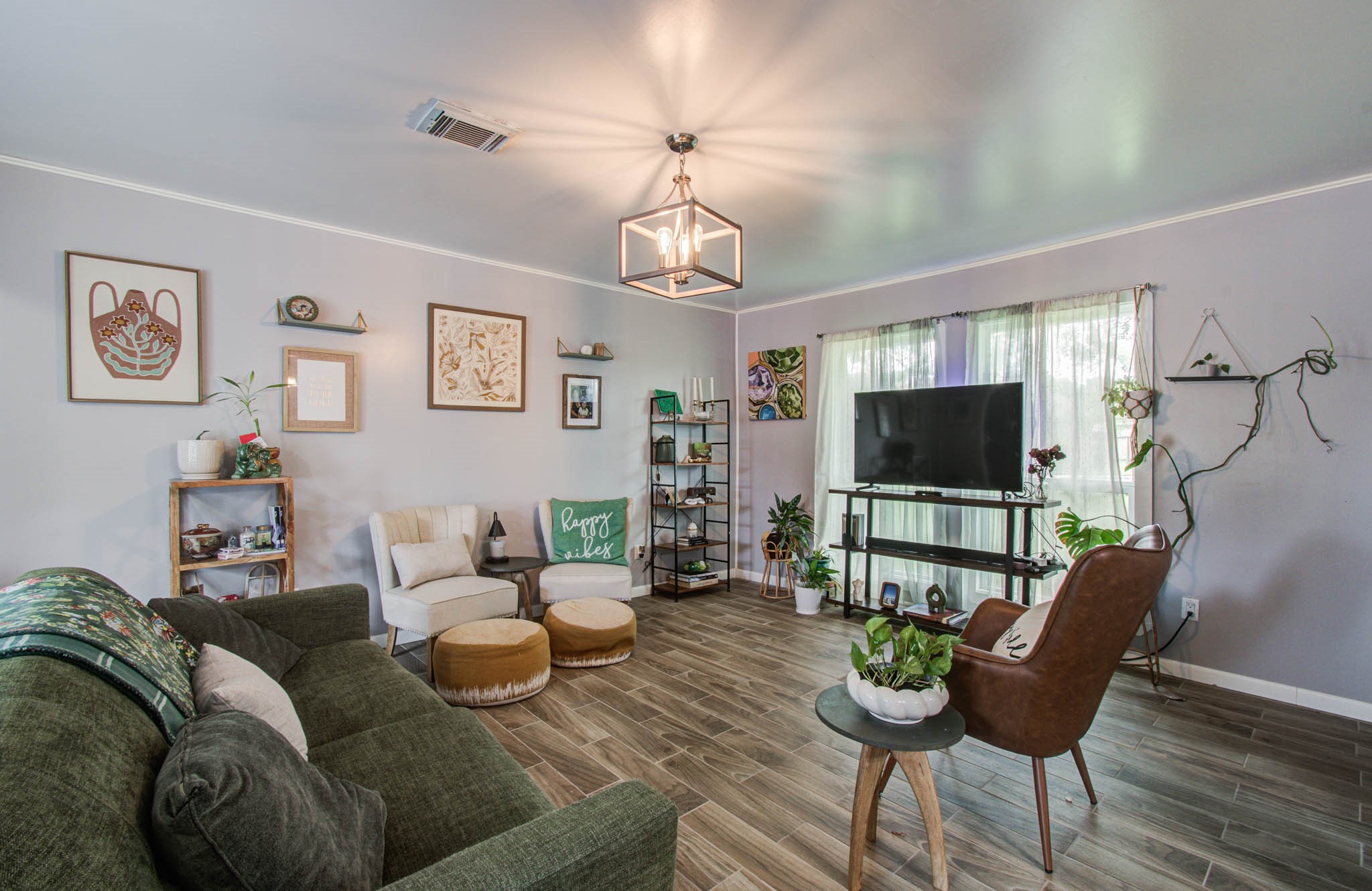 1327 Fallbrook Drive Houston, TX 77038 - Photo 9 of 34 a living room with furniture a flat screen tv and a window