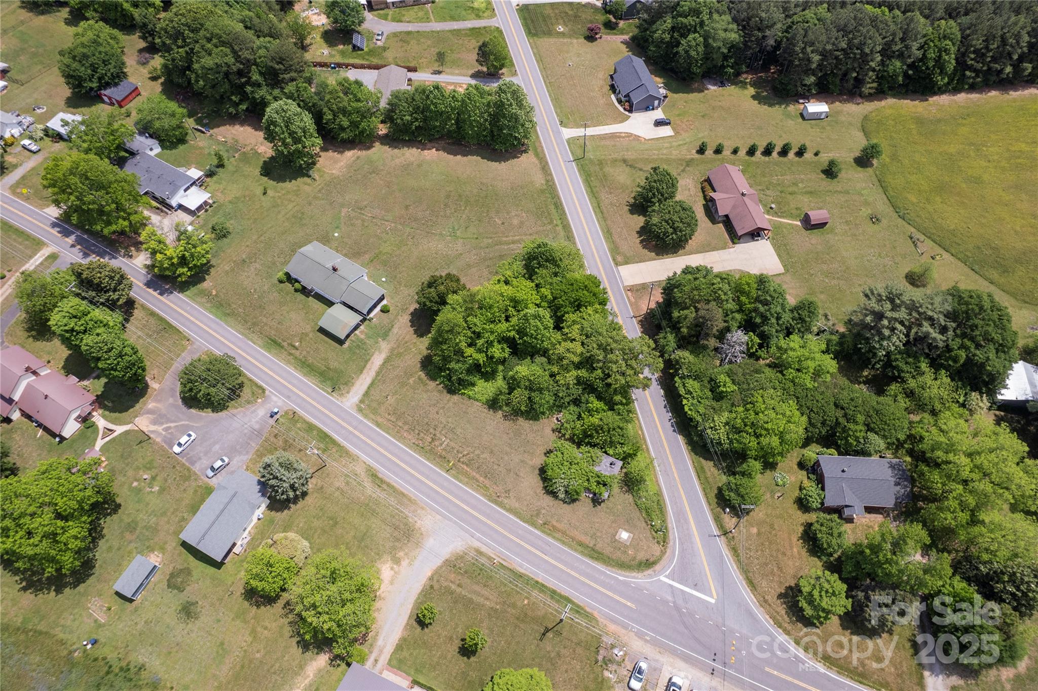 1558 Buffalo Shoals Road Catawba, NC 28609 - Photo 2 of 7 an aerial view of a house with a yard and garden