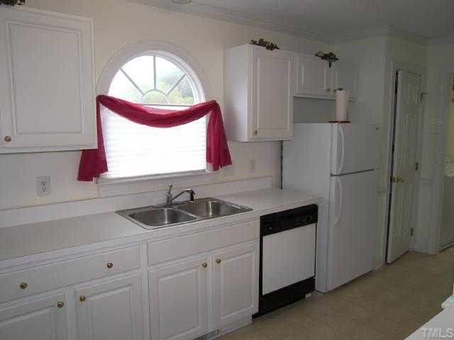 4309 Emmit Drive Raleigh, NC 27604 - Photo 3 of 12 Very effecient kitchen with new paint and flooring. The laundry room is in a seperate room.