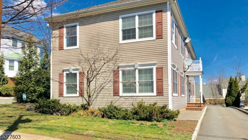 12 Cook Avenue Madison, NJ 07940 - Photo 2 of 7 a front view of a house with garden