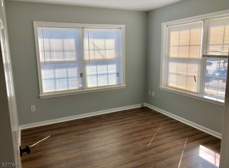 12 Cook Avenue Madison, NJ 07940 - Photo 5 of 7 an empty room with wooden floor and windows