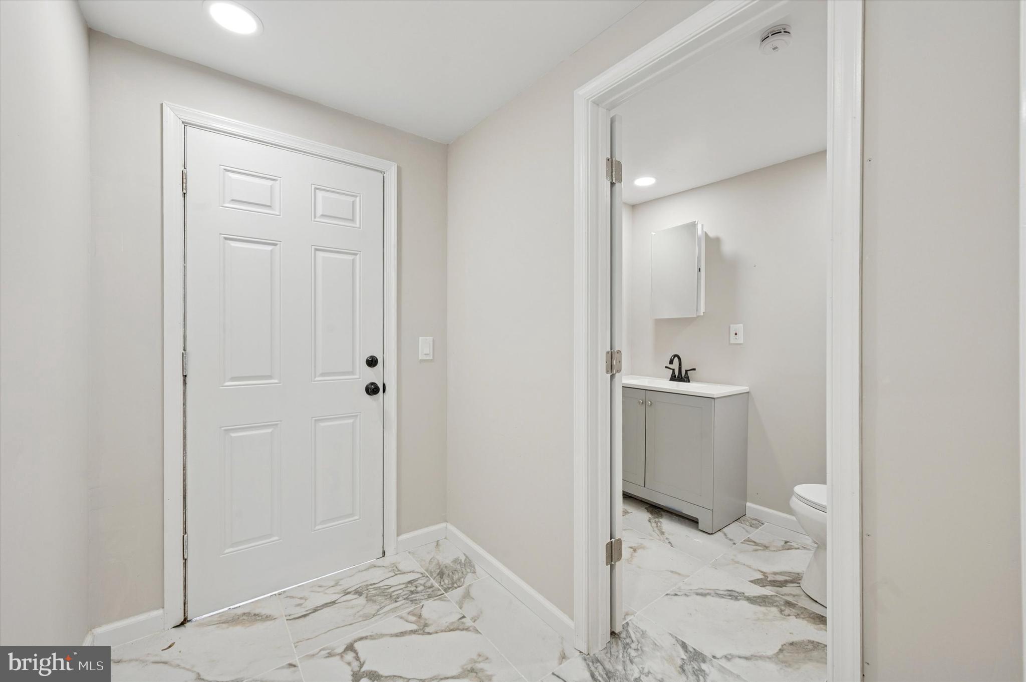 1339 Green Street Marcus Hook, PA 19061 - Photo 13 of 17 a bathroom with a sink and mirror