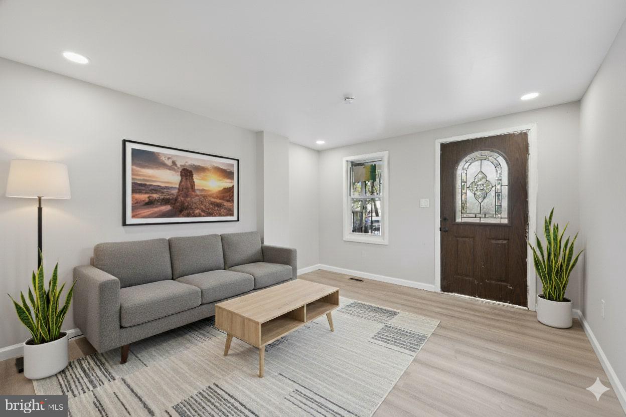 1339 Green Street Marcus Hook, PA 19061 - Photo 2 of 17 a living room with furniture and a wooden floor