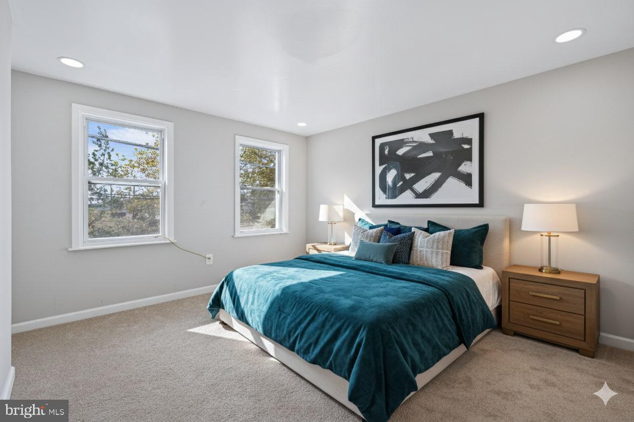 1339 Green Street Marcus Hook, PA 19061 - Photo 4 of 17 a bedroom with bed a lamp and a window