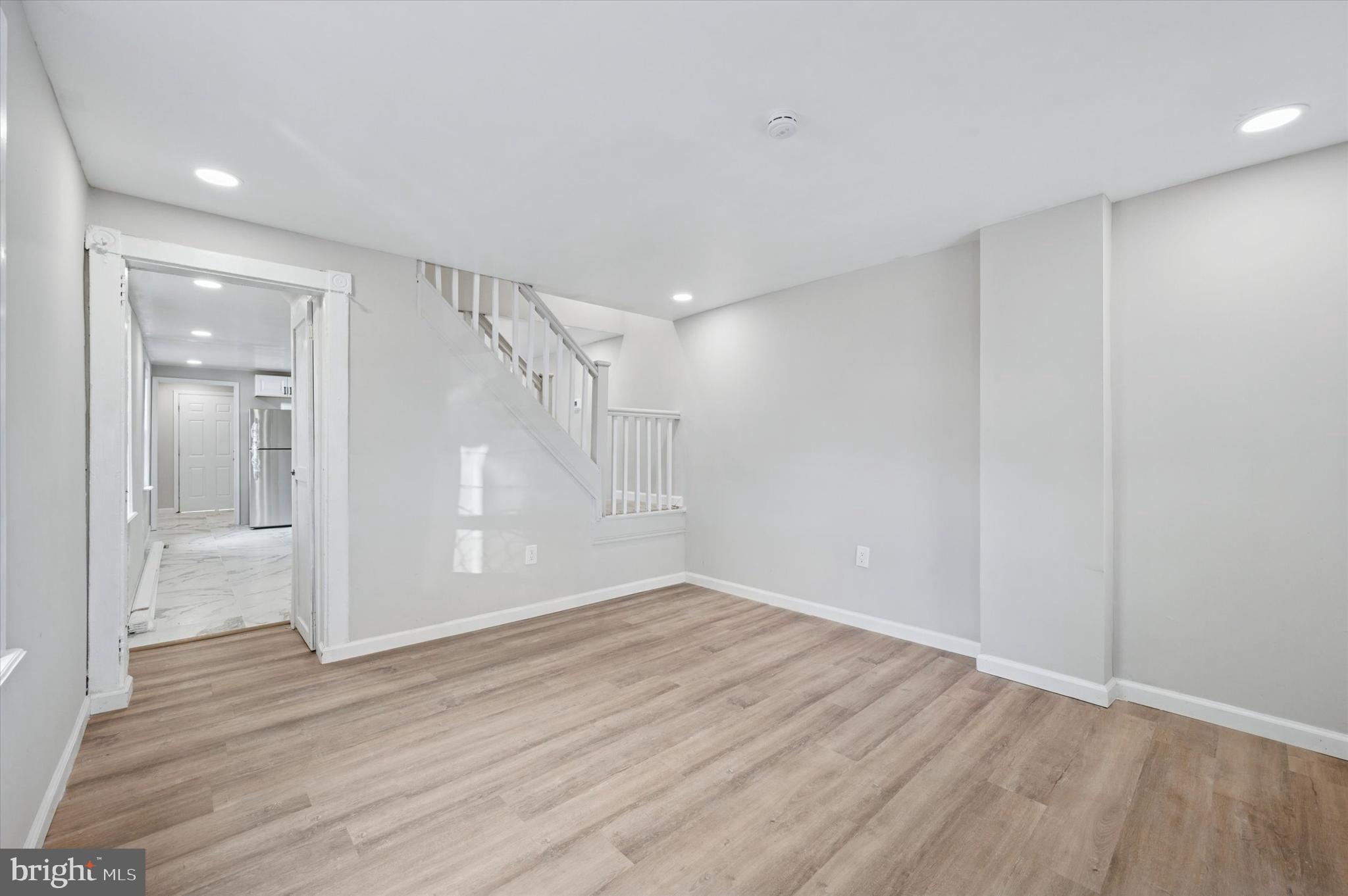 1339 Green Street Marcus Hook, PA 19061 - Photo 5 of 17 wooden floor in an empty room with a window