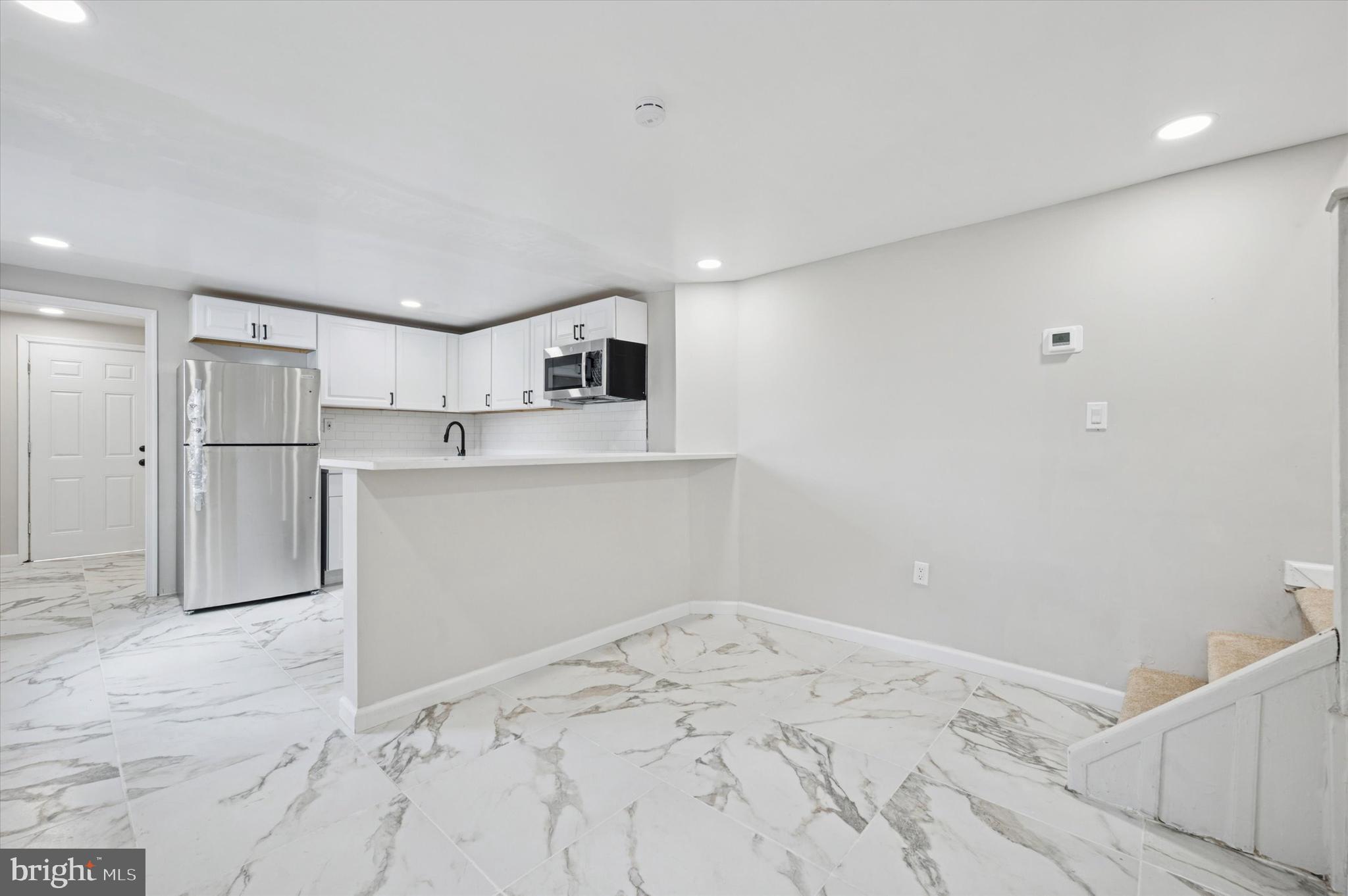 1339 Green Street Marcus Hook, PA 19061 - Photo 9 of 17 a room with a bed and cabinets