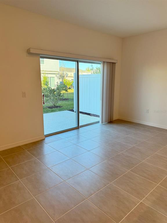 5040 Spangle Drive St. Cloud, FL 34769 - Photo 13 of 17 a view of an empty room with a window