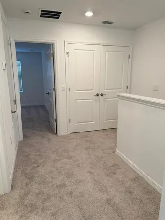 an empty room with closet area
