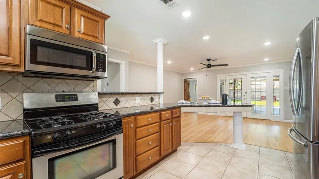 a kitchen with a stove and a microwave
