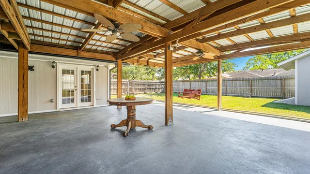 a view of a swimming pool with a patio and a swimming pool