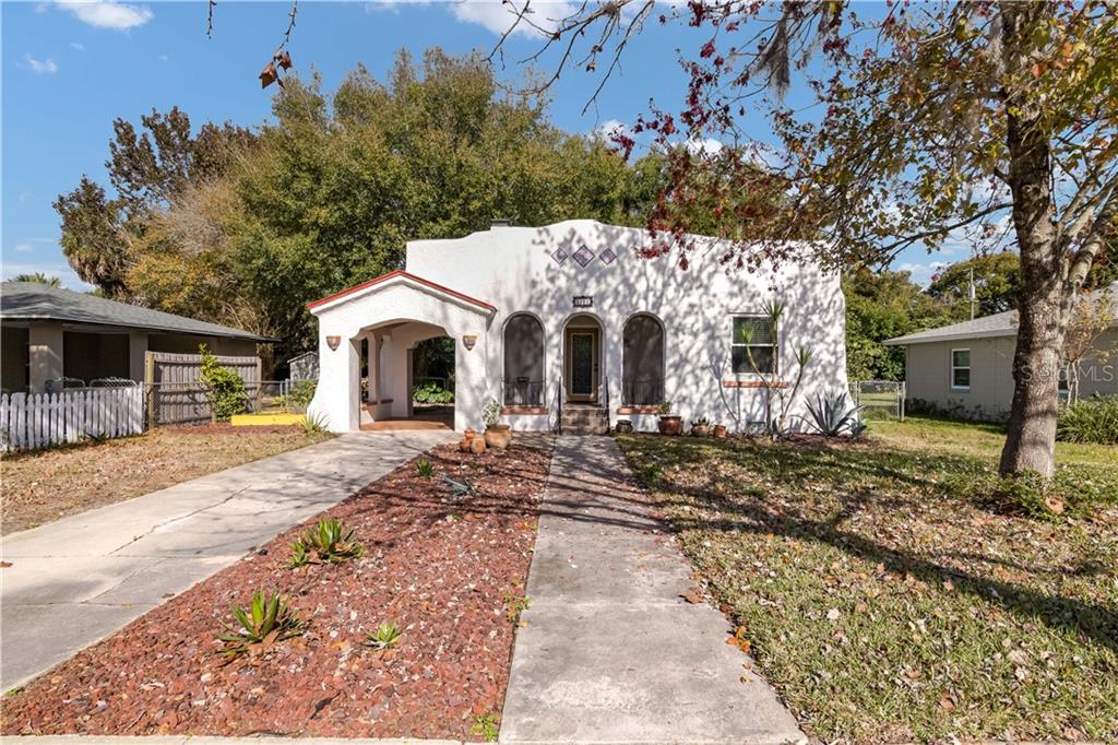 2155 Florence Road Mount Dora, FL 32757 - Photo 1 of 1 a front view of a house with a garden