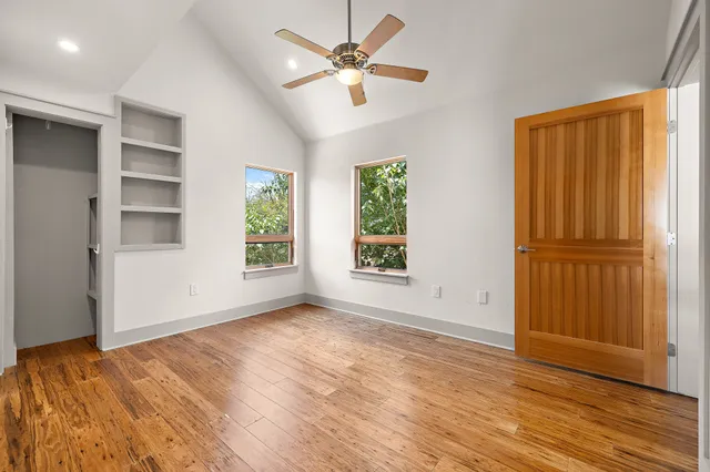 a bathroom with a sink a toilet a mirror and bathtub
