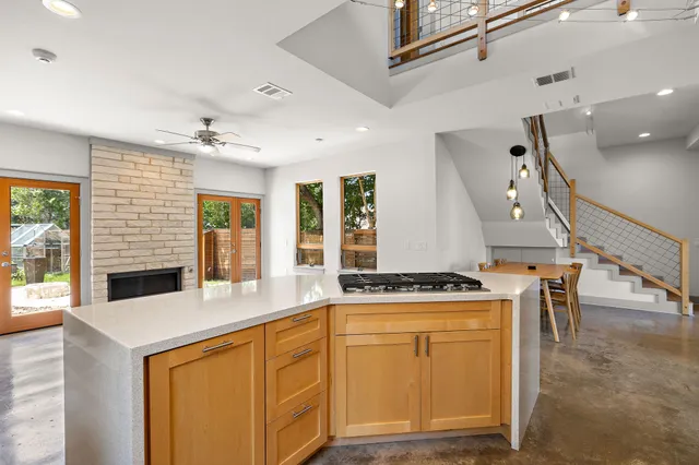 a kitchen with stainless steel appliances granite countertop a stove and a sink