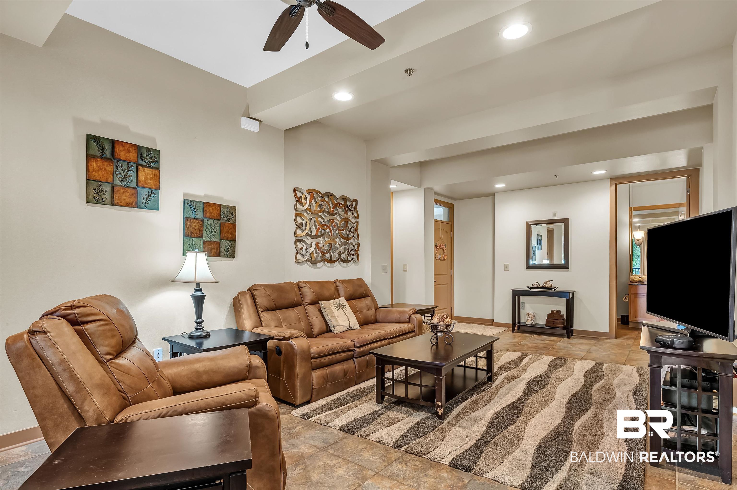 1430 Regency Road, Unit C201 Gulf Shores, AL 36542 - Photo 26 of 54 Living area featuring a ceiling fan and recessed lighting