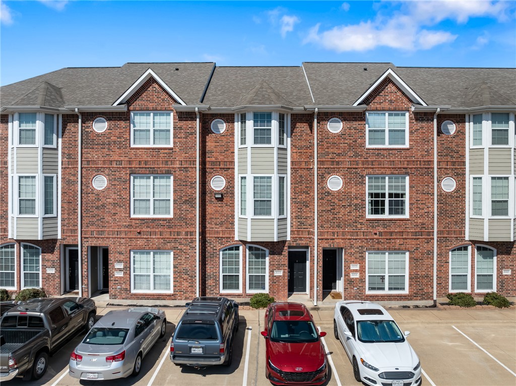a front view of a house with outdoor seating
