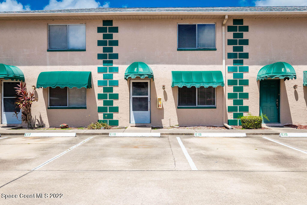 1880 Murrell Road, Unit 18 Rockledge, FL 32955 - Photo 1 of 26 a front view of a house with garden