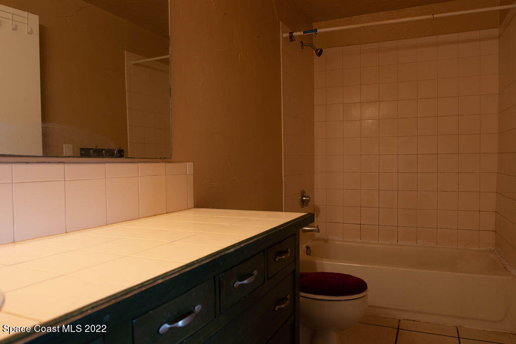 1880 Murrell Road, Unit 18 Rockledge, FL 32955 - Photo 21 of 26 a bathroom with a sink a toilet and a shower