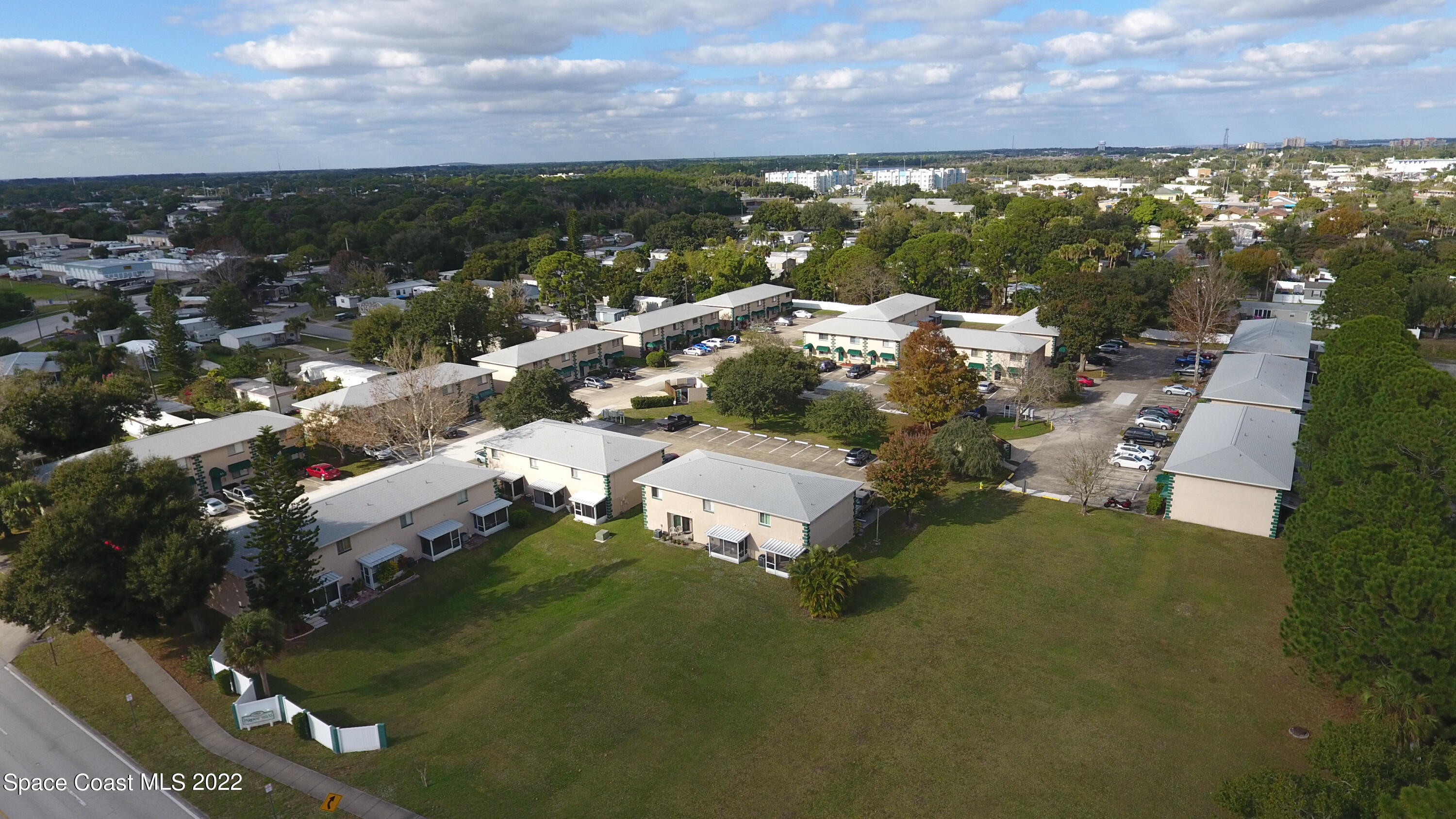 1880 Murrell Road, Unit 18 Rockledge, FL 32955 - Photo 26 of 26 an aerial view of residential houses with outdoor space and trees