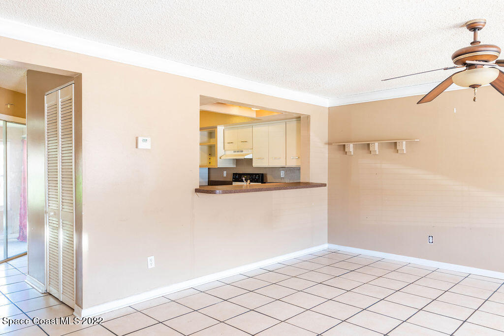 1880 Murrell Road, Unit 18 Rockledge, FL 32955 - Photo 6 of 26 a view of a room with a ceiling fan and window